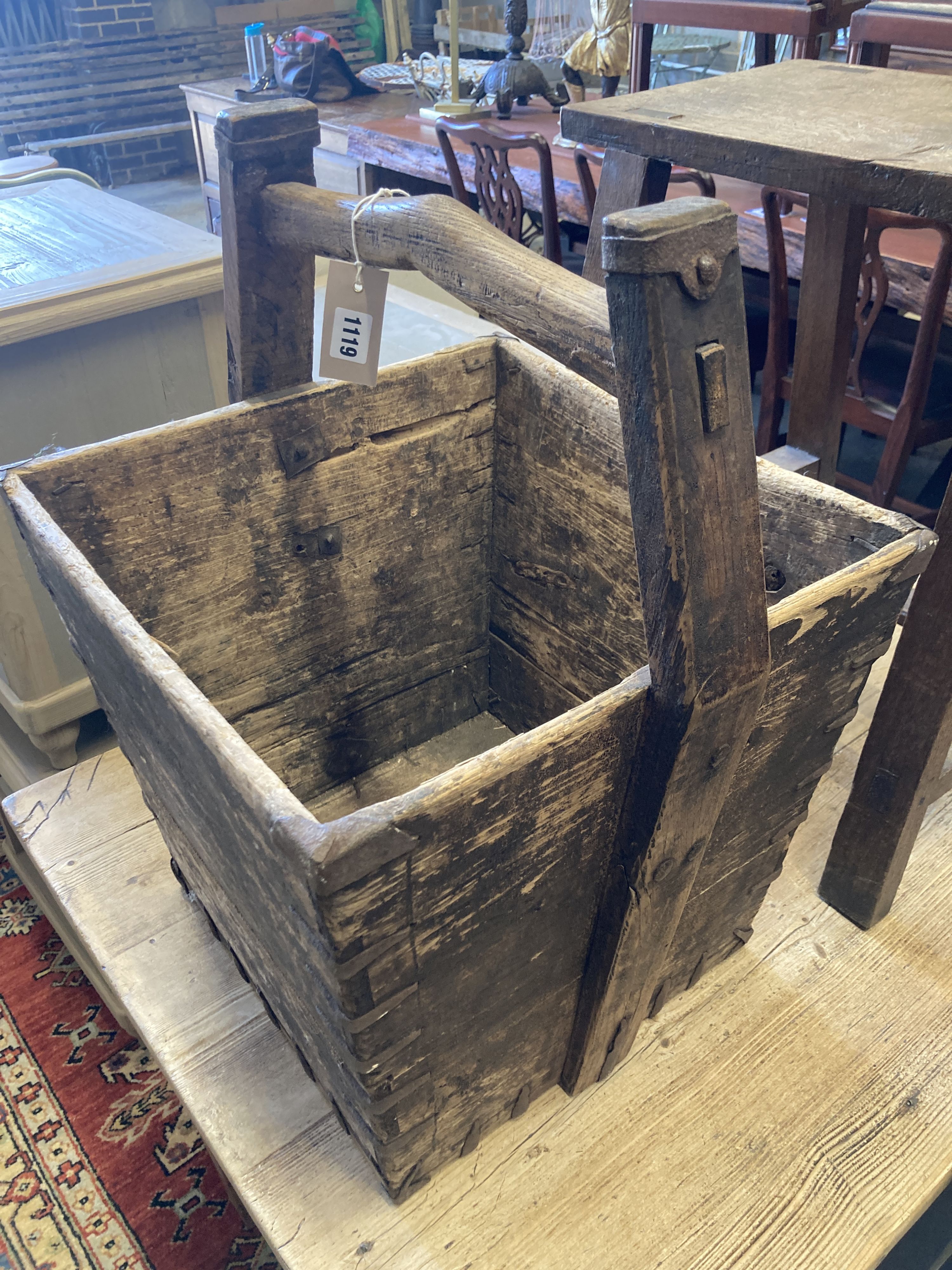 A rectangular provincial oak low table, width 55cm, depth 32cm, height 55cm together with a square Chinese bucket
